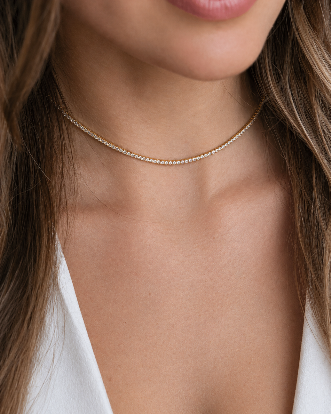 L'Éclat Continu Doré — Collier tennis cristaux chaîne dorée en acier inoxydable | Maison Orynn
