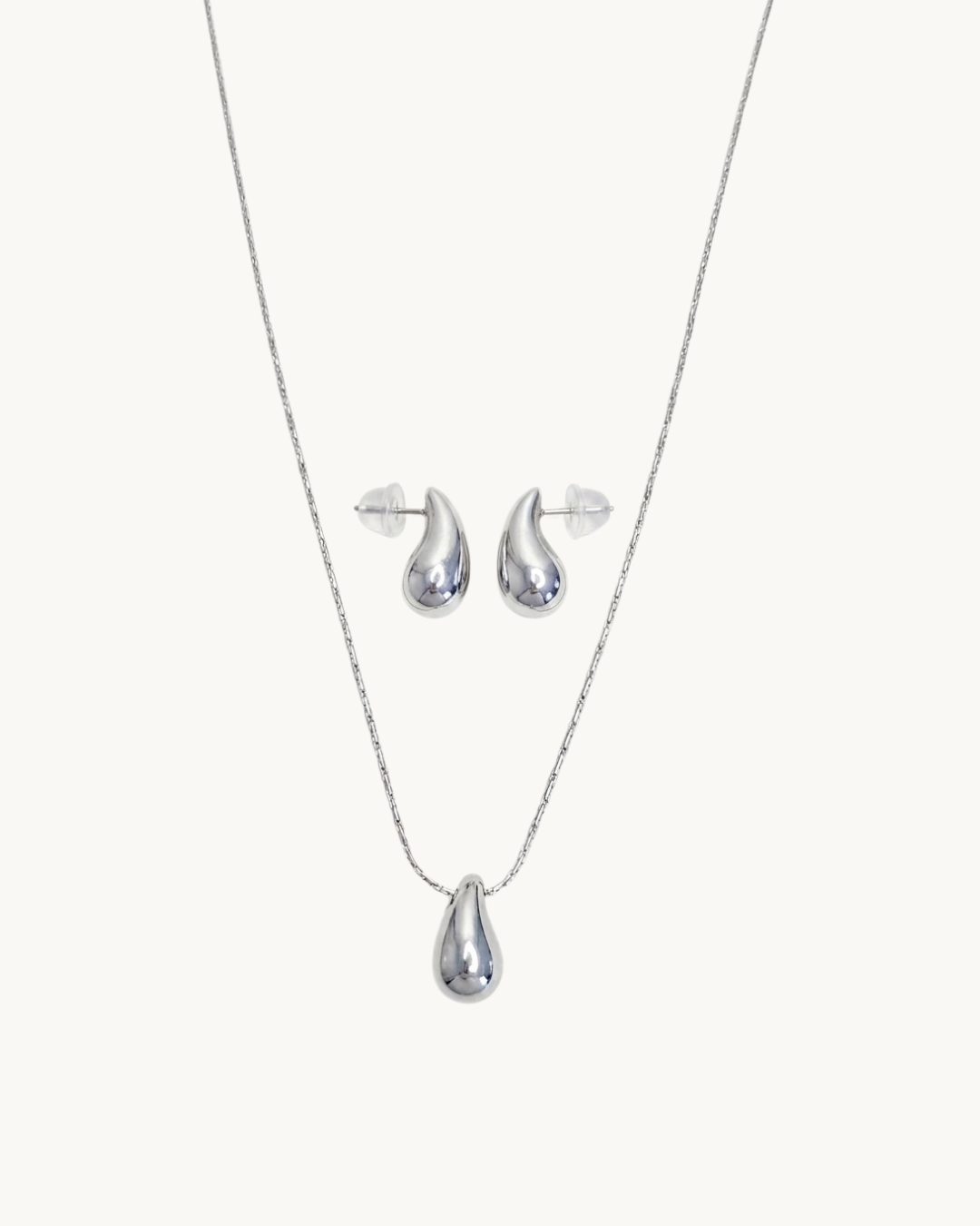L'Apogée Argenté — Set collier et boucles d'oreilles goutte argentées en argent 925 | Maison Orynn