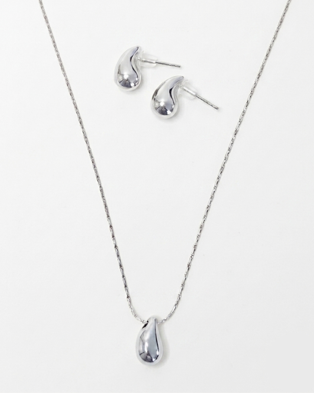 L'Apogée Argenté — Set collier et boucles d'oreilles goutte argentées en argent 925 | Maison Orynn