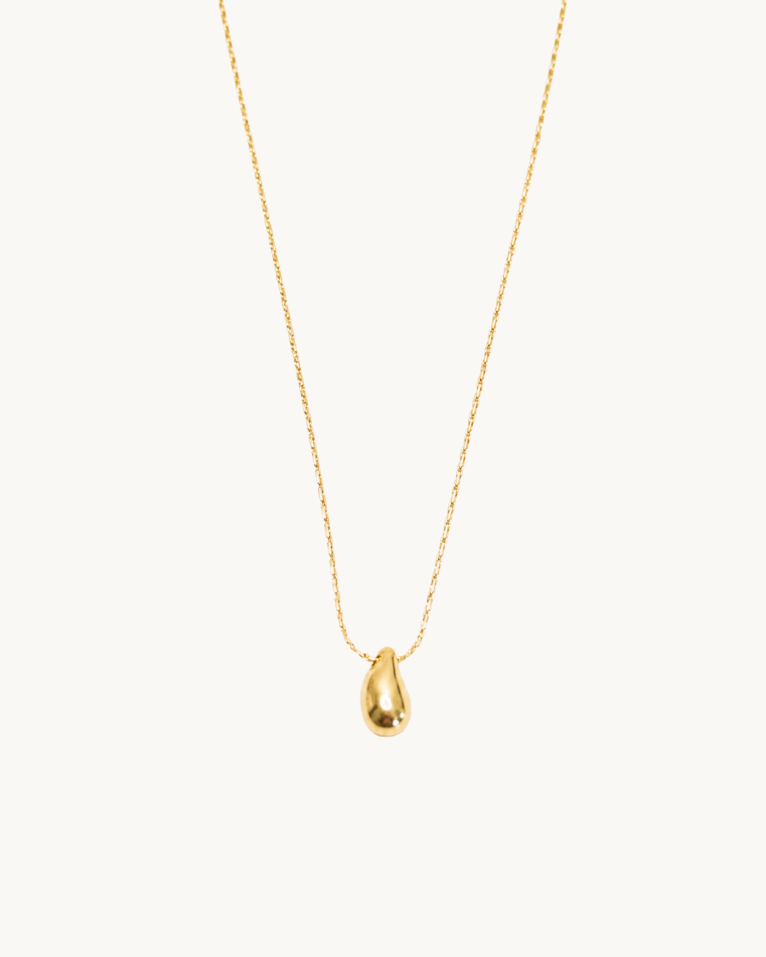 L'Étincelle Doré — Collier pendentif goutte doré en acier inoxydable | Maison Orynn