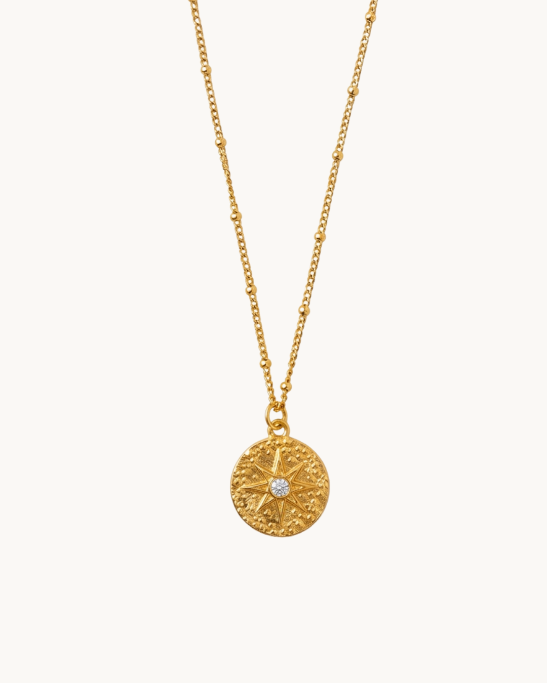 Le Médaillon — Collier médaillon martelé étoile polaire doré en acier inoxydable | Maison Orynn