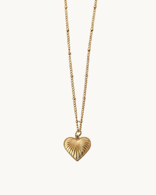 Le Solstice — Collier pendentif cœur rayons dorés en acier inoxydable | Maison Orynn
