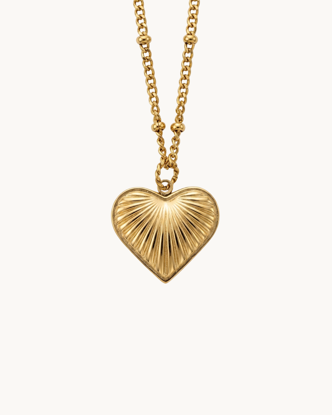 Le Solstice — Collier pendentif cœur rayons dorés en acier inoxydable | Maison Orynn