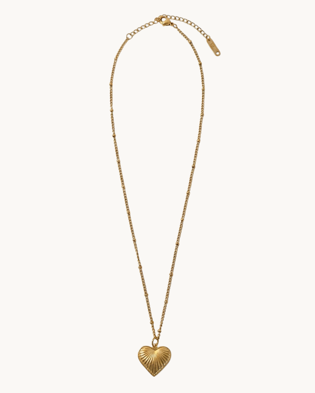 Le Solstice — Collier pendentif cœur rayons dorés en acier inoxydable | Maison Orynn